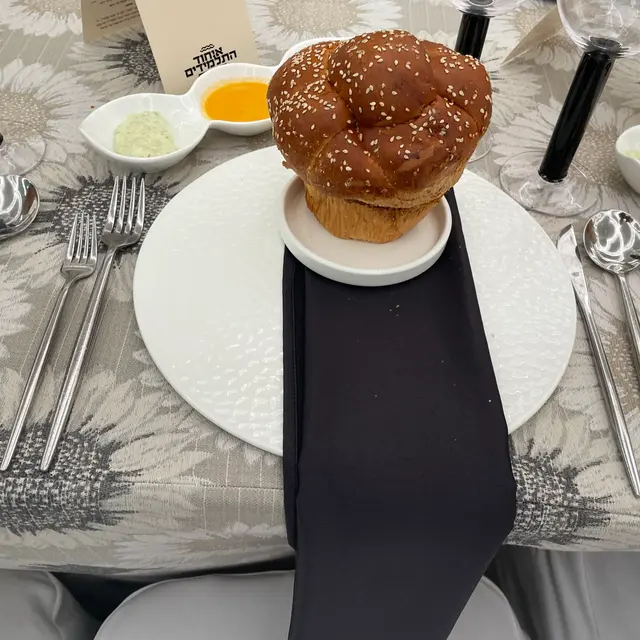 A Shabbos table set by Mashmanim